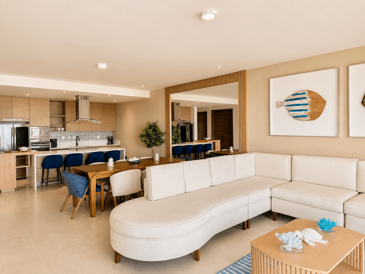 Sala de estar, comedor y cocina con acabados modernos.